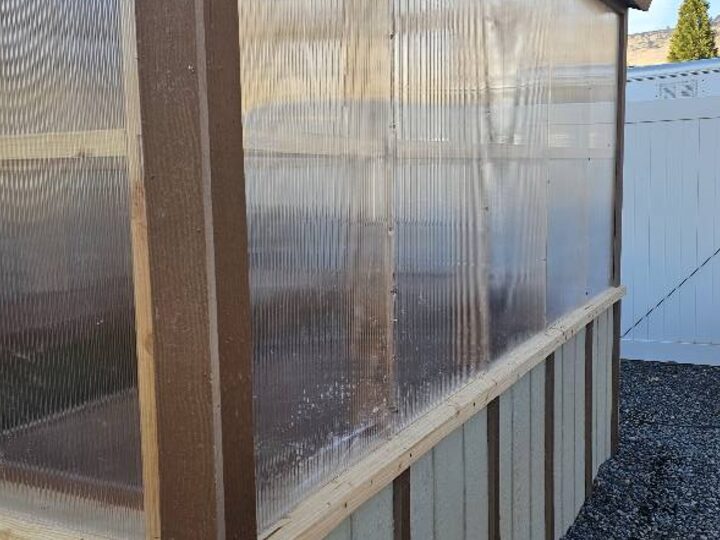 Side view of a mono-slope greenhouse showing the polycarbonate wall panels